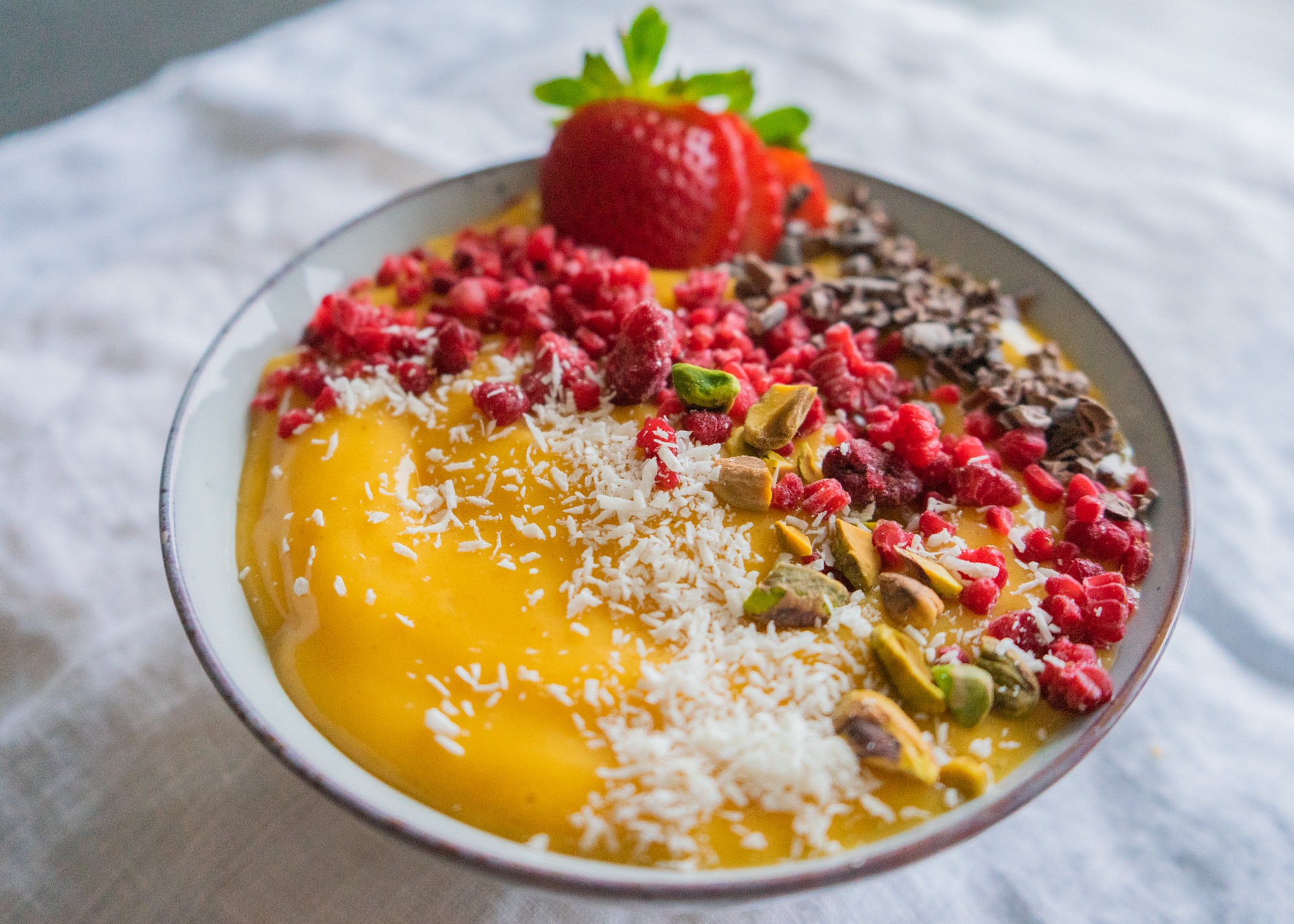 Mango smoothie bowl topped